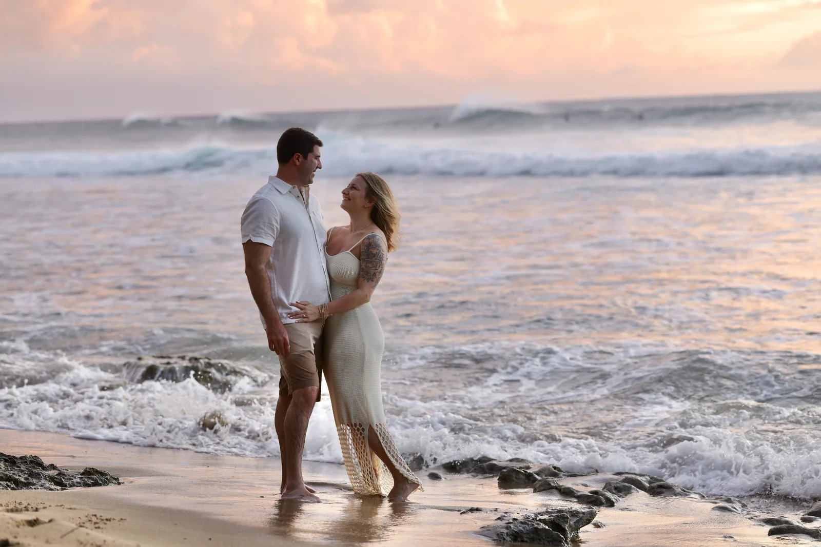 Couple photographed at golden hour on Condado Beach, Puerto Rico