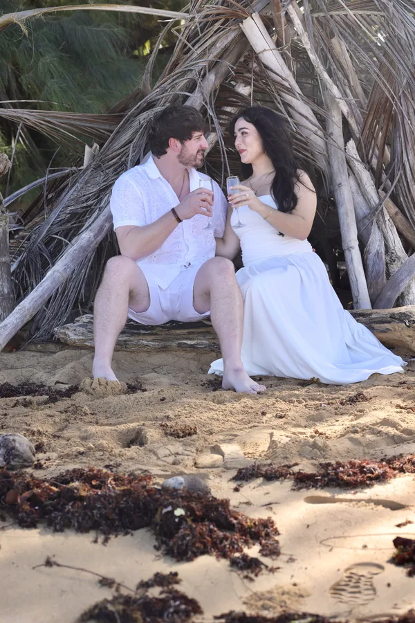 Styled romantic sunset picnic for two on a beach in Condado